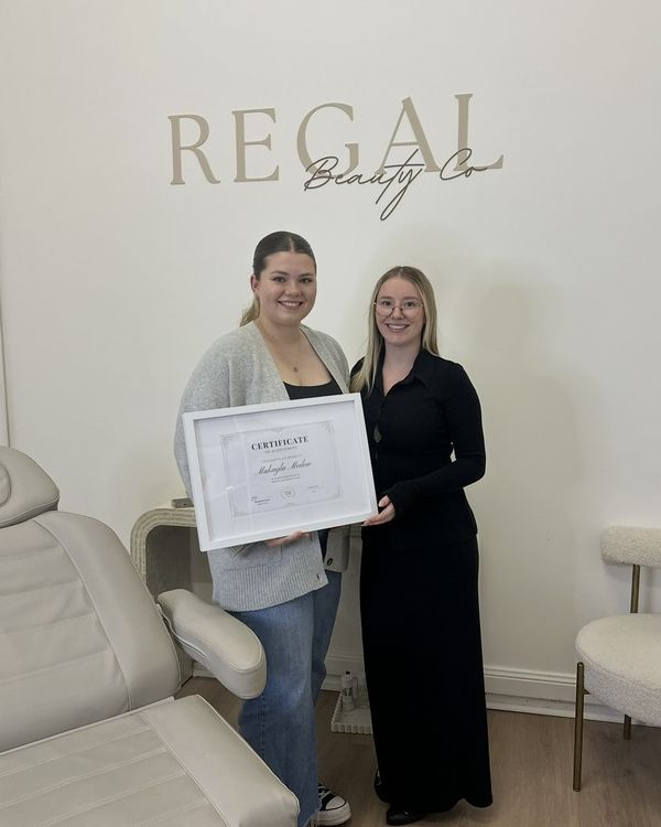 Makayla with her training certificate